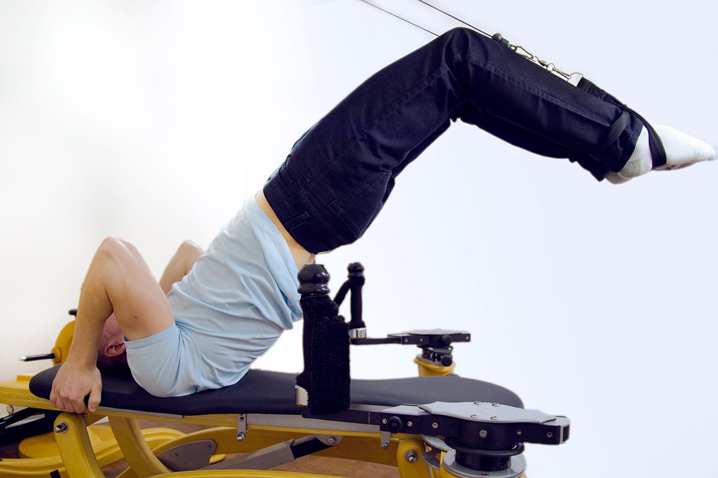 man using GYROTONIC machine to stretch