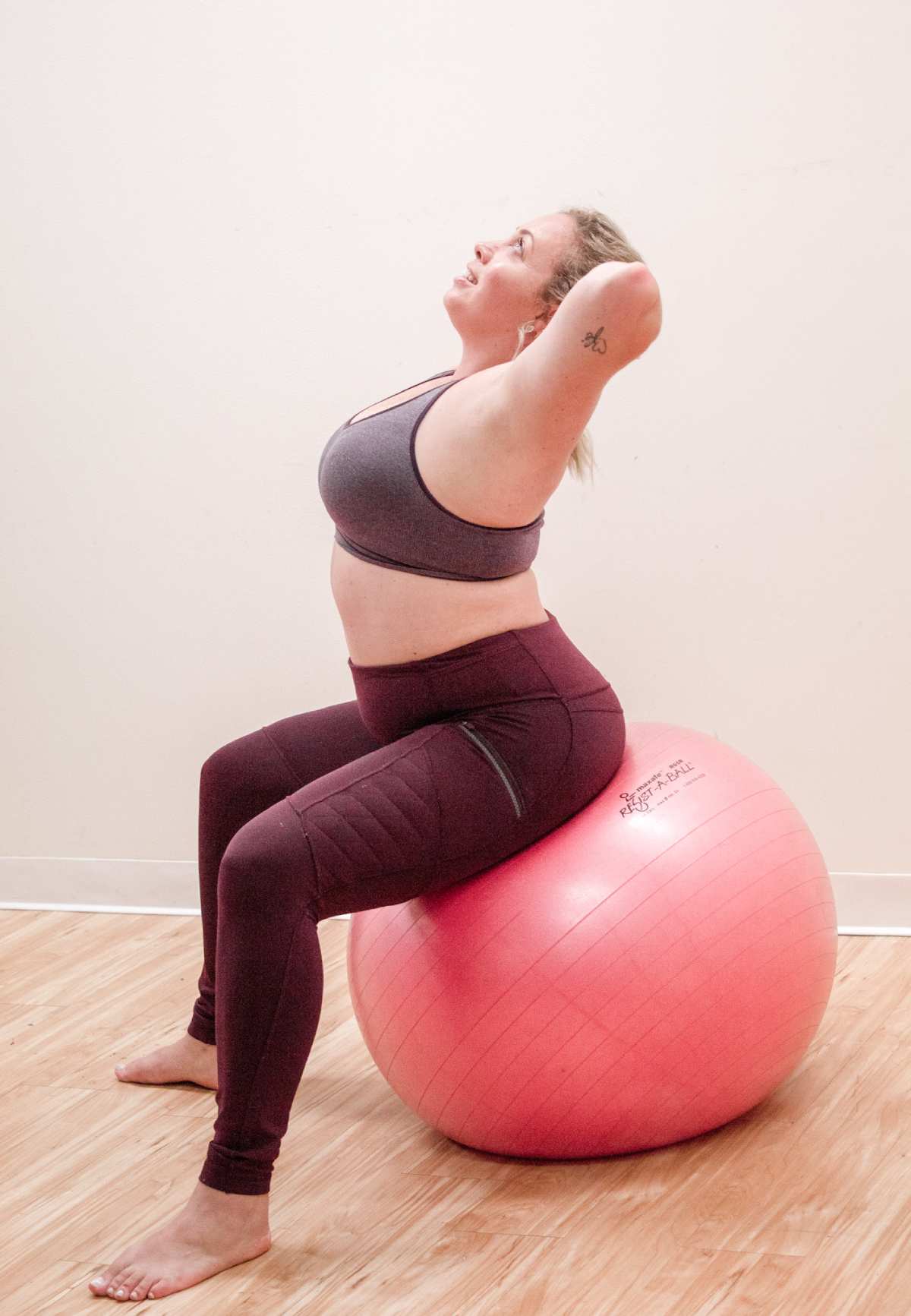 woman streching on a large exercise ball