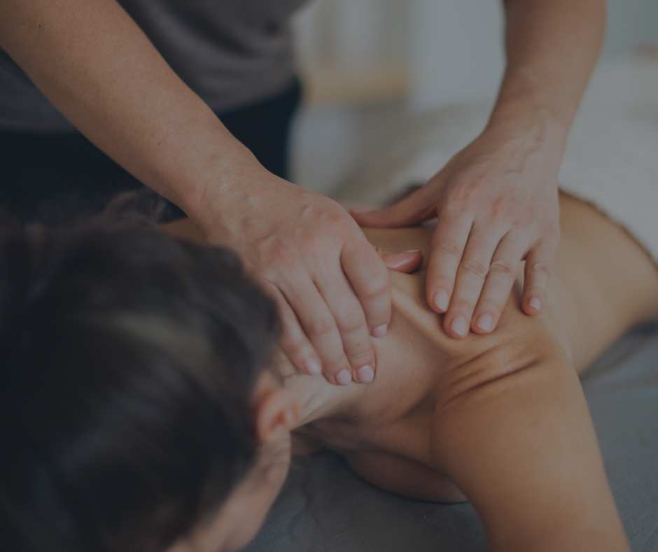 person lying face down receiving a massage