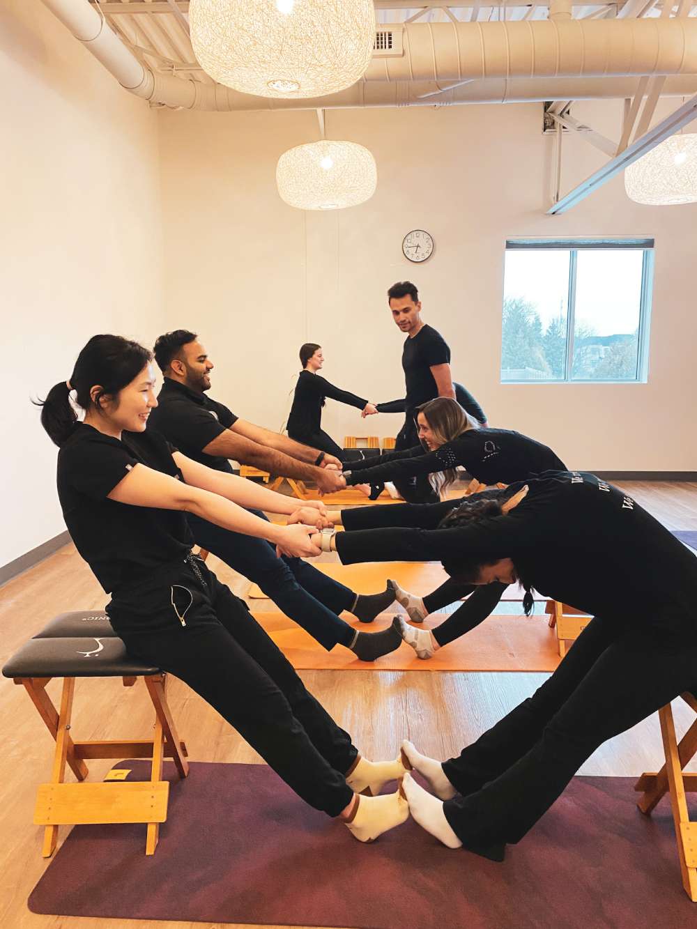a group of people in a gym doing exercises
