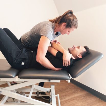 a therapist performing chiropractic