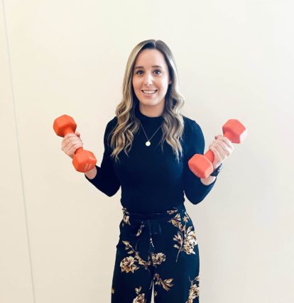 Girl holding dumbbells