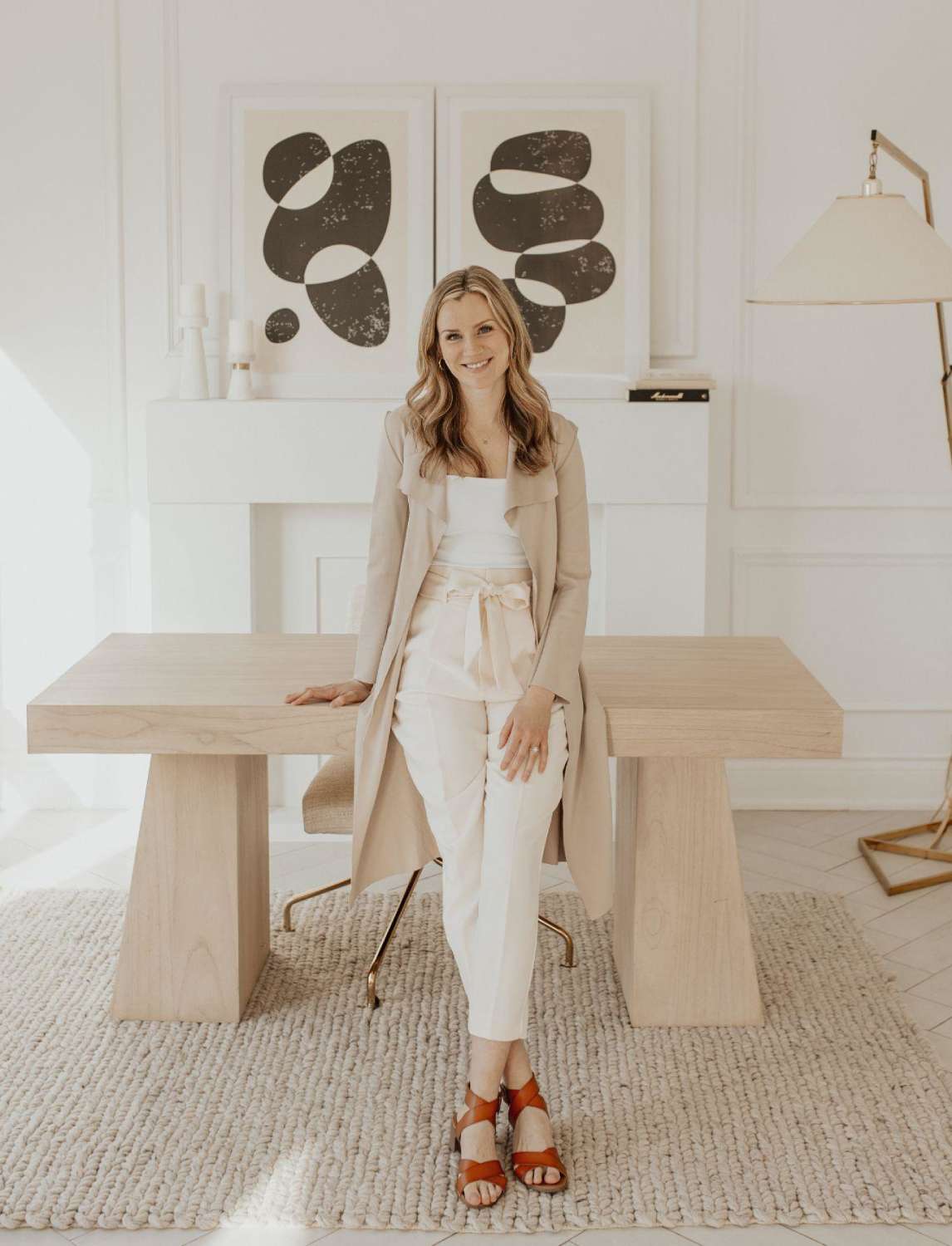 a woman leaning against a table