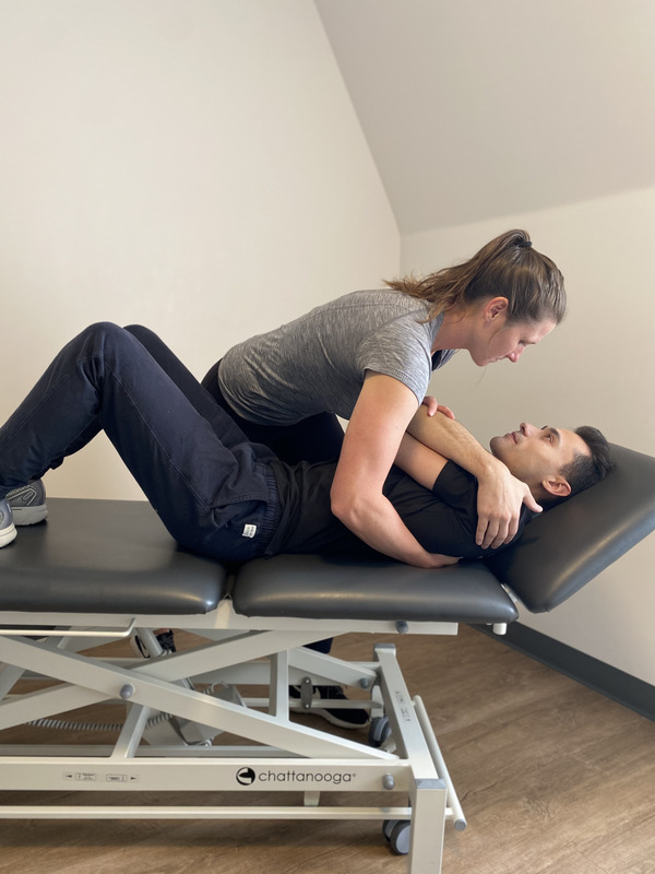 Trainer preforming exercise