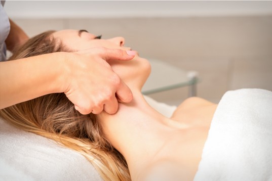 Woman getting neck massage