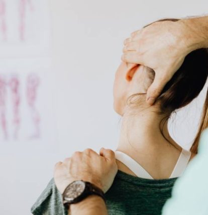a man stretching a woman's neck